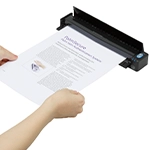 person feeding a paper into the ScanSnap iX100 black scanner