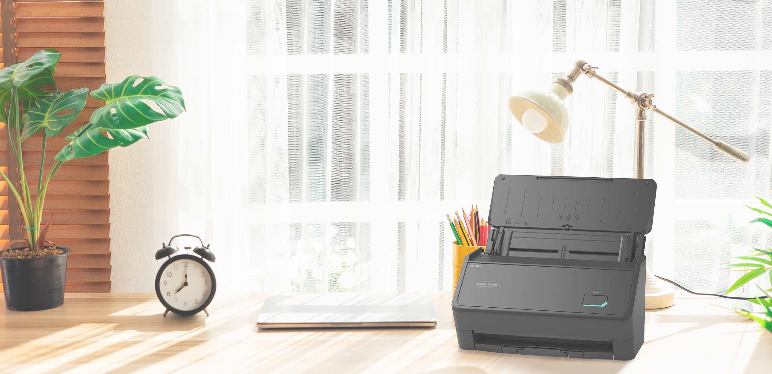 ScanSnap iX2400 black on a desk
